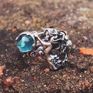 Adjustable sterling silver Mermaid ring with blue topaz